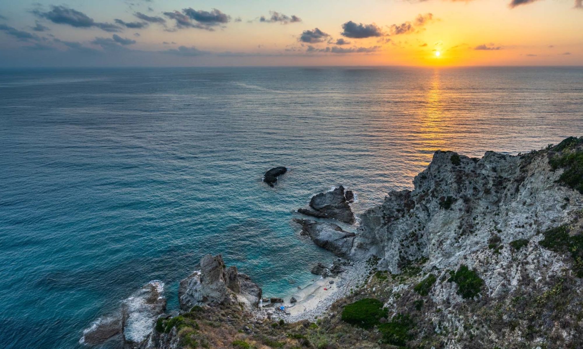 Sunset over the Mediterranean from a rocky Italian coastline